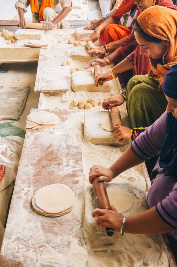 Volunteers making rotis in Langar kitchen