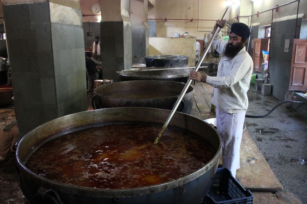 Preparing large quantities of dal in huge cauldrons